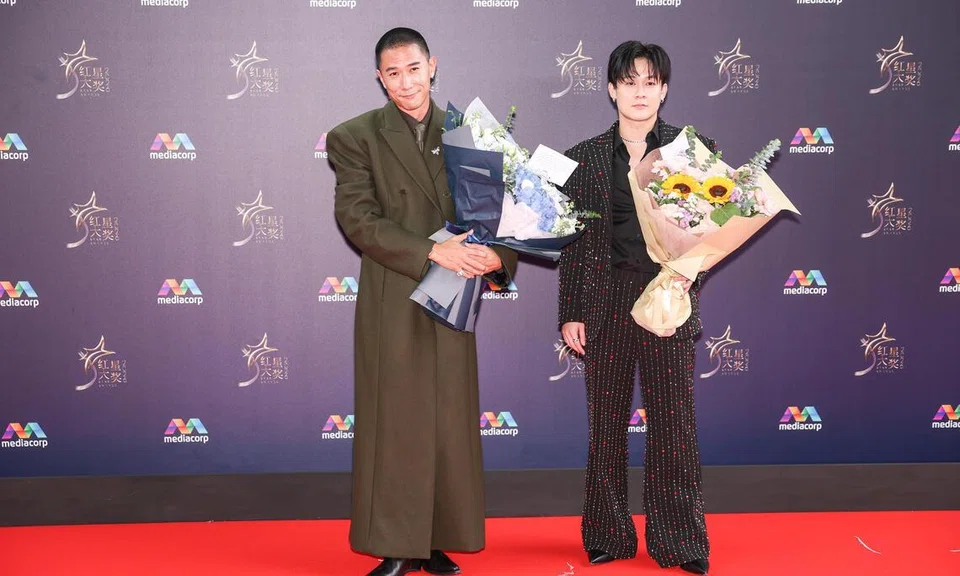 Desmond Tan (left) on the red carpet at the Star Awards at Mediacorp on April 19. 