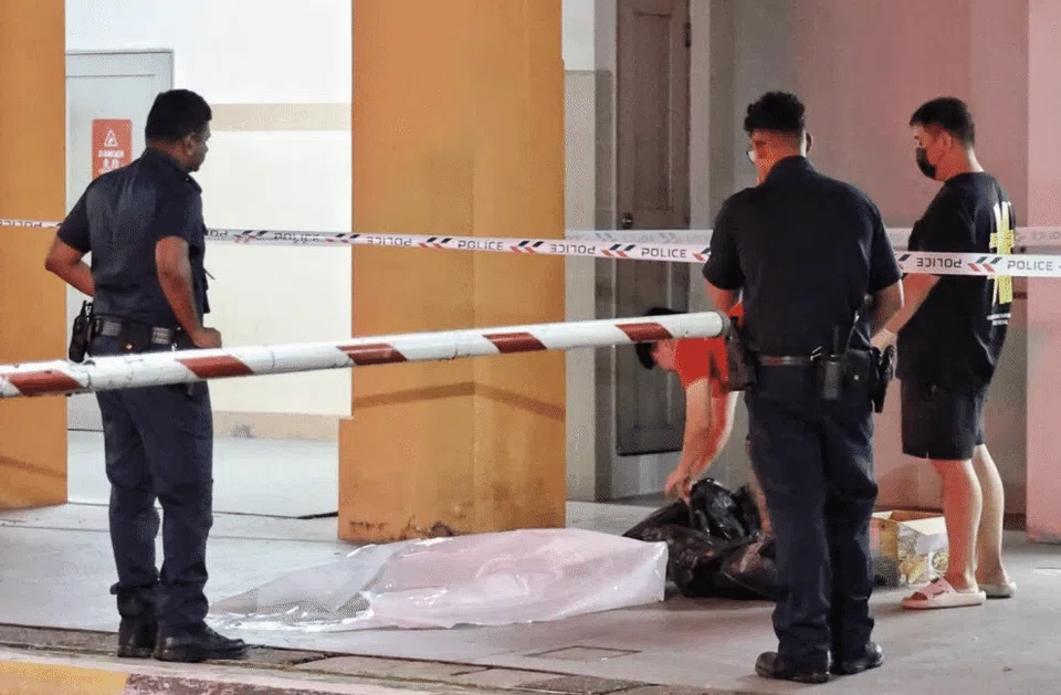 Police officers arrived at the scene and set up a cordon, while two men helped to remove the dog's body. 