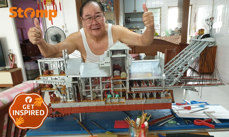 Stomper Rak Cheong's father posing with a ship model, which can take years to complete.
