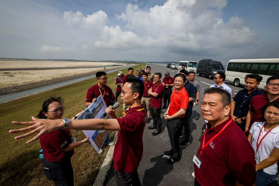 PM Lawrence Wong at a site briefing during his visit to the completed polder at Pulau Tekong on Sept 8.