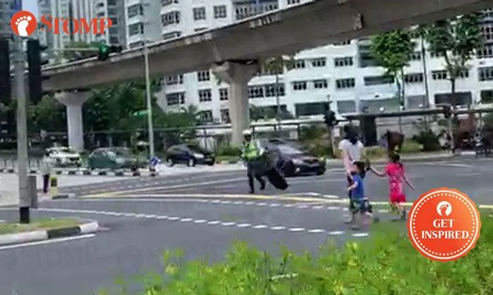 Officer goes beyond call of duty to carry fallen chair away from Bukit Panjang junction