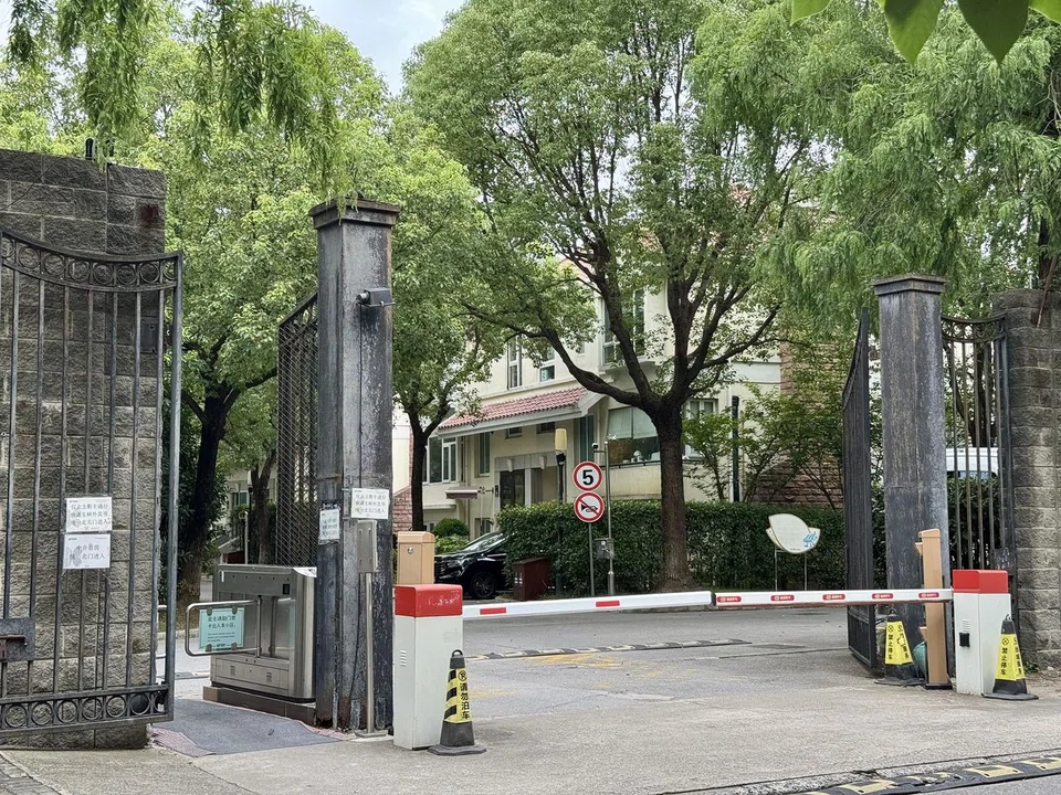 Entrances to Green Hills, a sprawling gated residential enclave with over 400 Tudor-styled bungalows, manicured gardens and tree-lined roads in Shanghai.