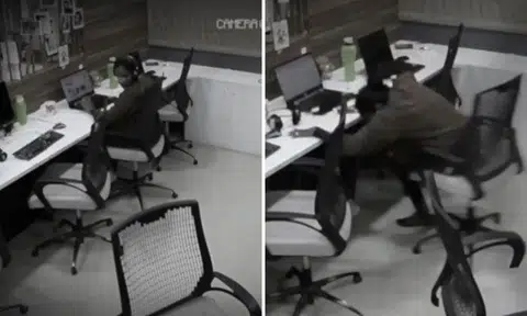 Chairs roll and bottle gets flung on their own in creepy office, but woman carries on working