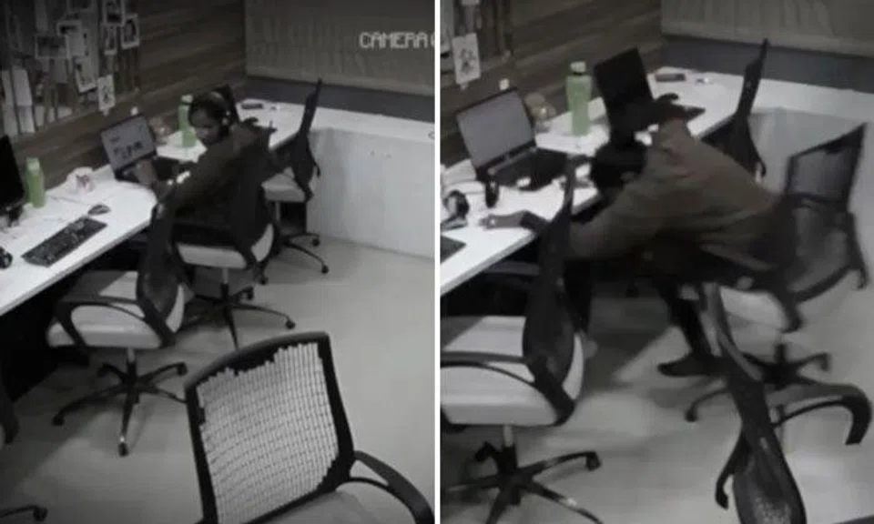 Chairs roll and bottle gets flung on their own in creepy office, but woman carries on working