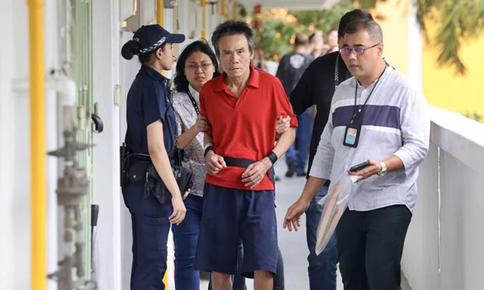 Ng Chen Heng, 66, who has been charged with murder, being taken back to the crime scene in Ang Mo Kio by police on Jan 21. PHOTO: LIANHE ZAOBAO
