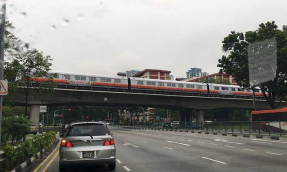 Up to four south-bound trains could be seen at a standstill on the tracks along Ang Mo Kio Avenue 1 at around 8.30am. (PHOTO: THE STRAITS TIMES)