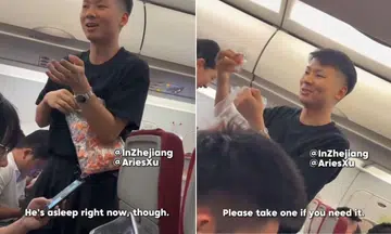 father distributes earplugs on plane