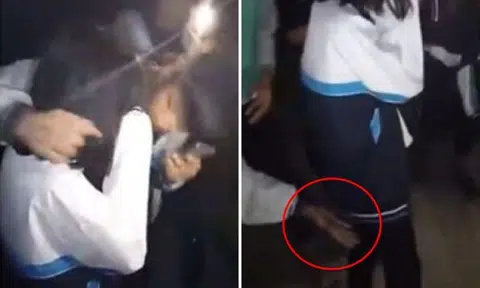 Male students kiss and grope unwilling female classmate in China -- while other guys watch