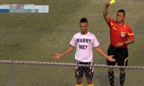 Guam football player gets yellow card for public marriage proposal on pitch 