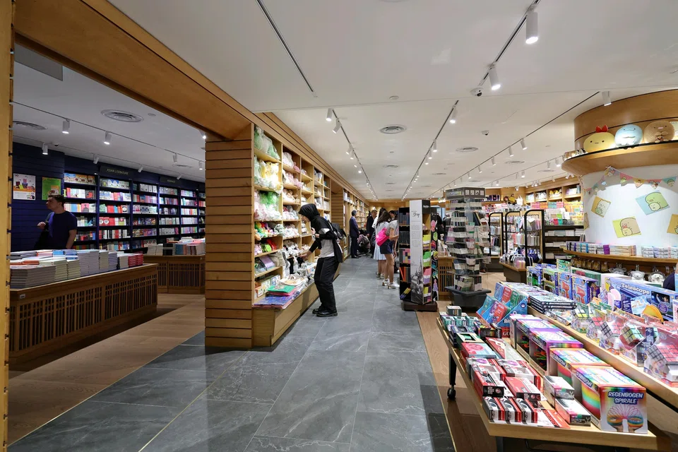 The bookstore at Raffles City is divided into the Reading Room (left) and main area (right).
