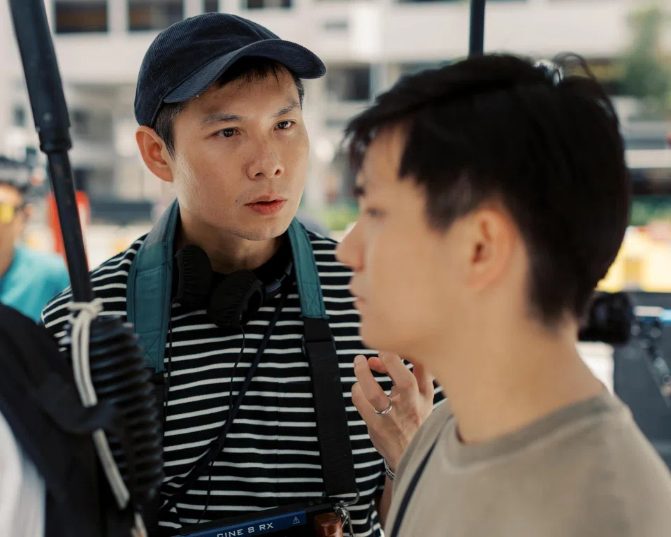 Director Anthony Chen (left) and actor Koh Jia Ler on the set of We Are All Strangers, the third chapter of Chen's Growing Up trilogy of dramas.