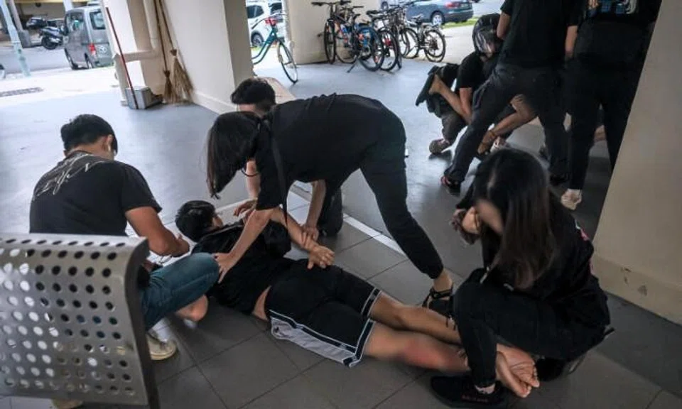 2 men subdued after resisting arrest for drug offences in Telok Blangah void deck