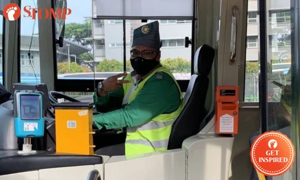 Tower Transit N. 167 bus captain wearing traditional tanjak