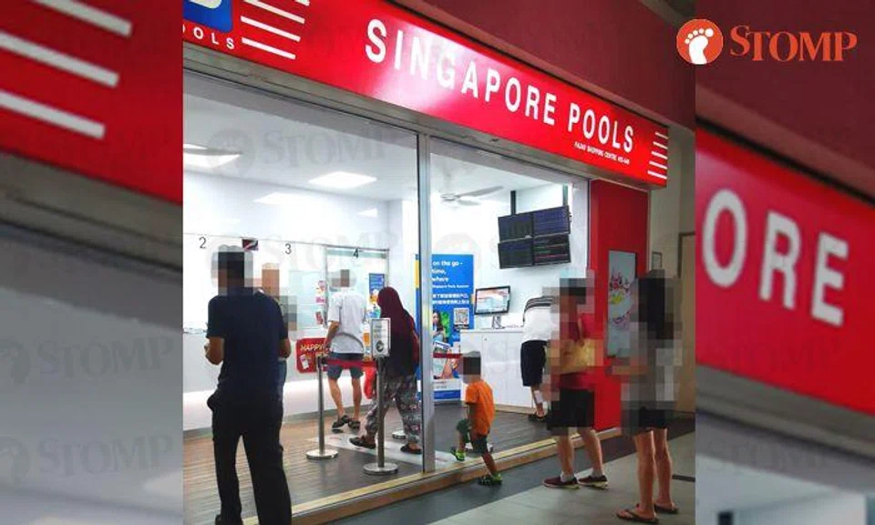Passer-by upset to see mum bringing child to Singapore Pools as it is 'teaching him to gamble'