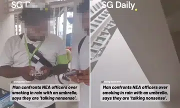 man confronts enforcement officers after smoking at void deck