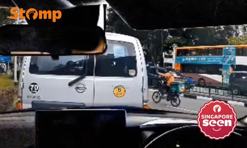 Close call as 'transformer' delivery rider cuts into lane at Compassvale Road