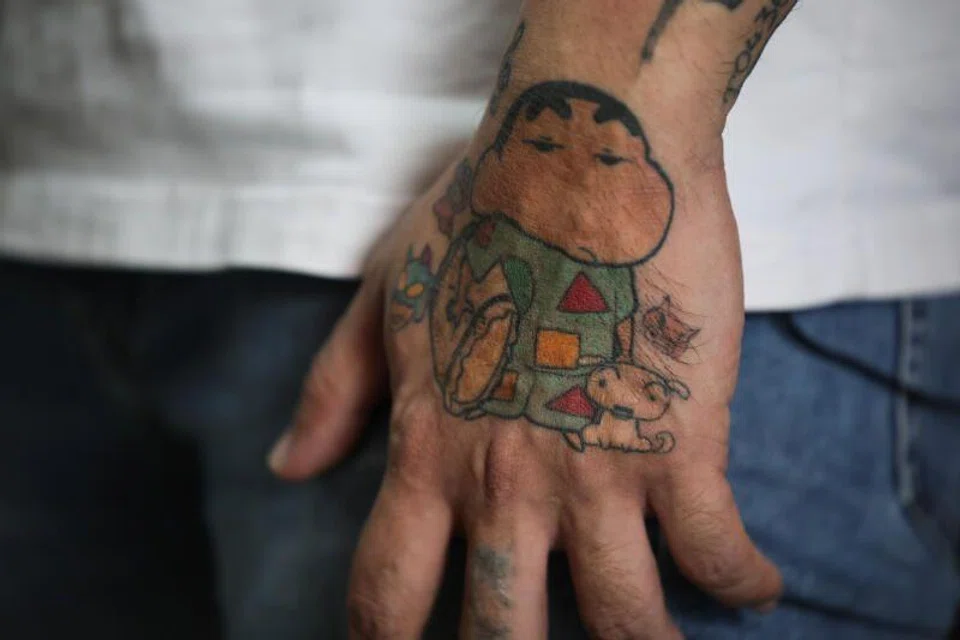 Mr Delfard Tay had tattoo of Crayon Shin-chan.