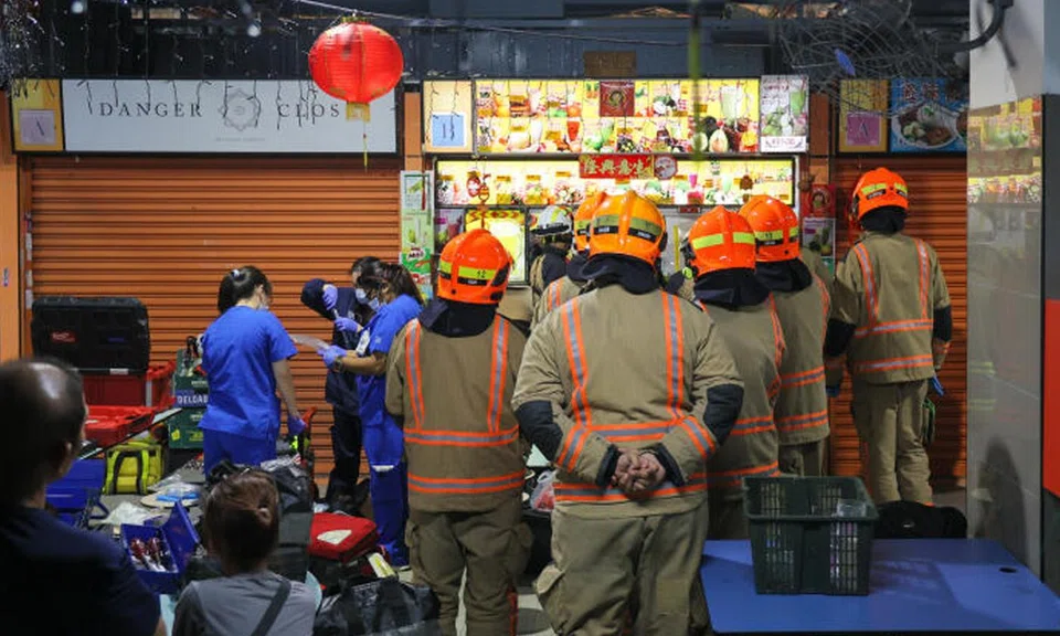 Firefighters, rescue specialists from the Disaster Assistance and Rescue Team and an SCDF paramedic worked together to rescue a man whose right hand was trapped in a sugar cane pressing machine on March 9.