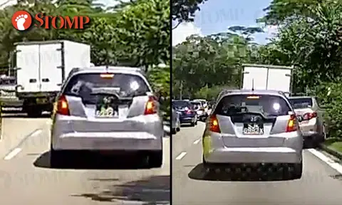 Lorry driver flees after colliding into car, sends it crashing up road divider on Lentor Ave