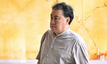 two men charged over helping lim tean escape to johor