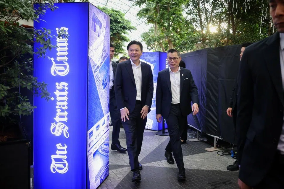 PM Lawrence Wong with ST editor Jaime Ho at the gala dinner.