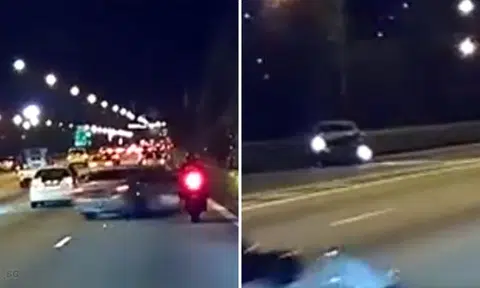 Driver prevents motorcyclist from overtaking, swerves out of control and crashes into road divider