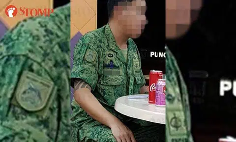 SAF investigating tattooed man wearing an SAF uniform with a Major rank