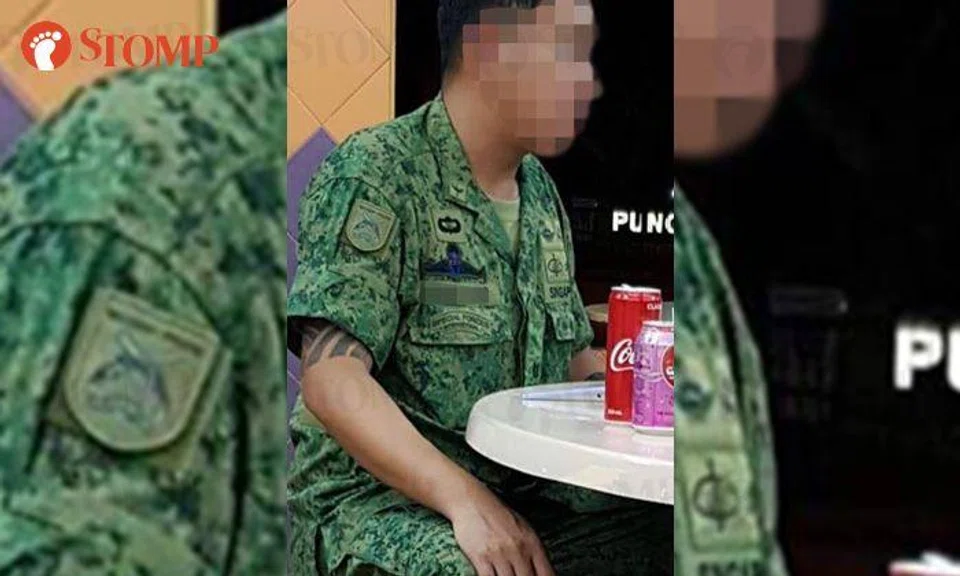 SAF investigating tattooed man wearing an SAF uniform with a Major rank