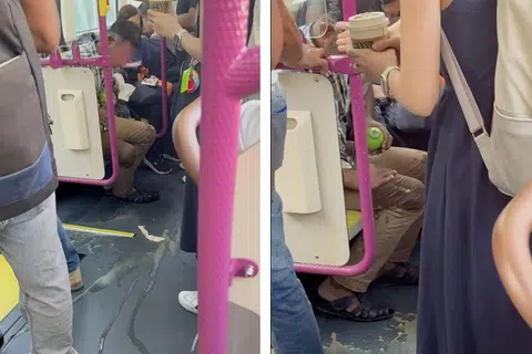 The man tried to remove the spilt coffee on his trousers.