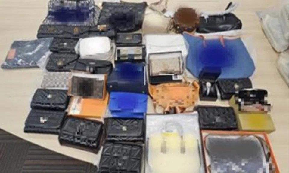 A 46-year-old woman was arrested after being found selling counterfeit goods. 