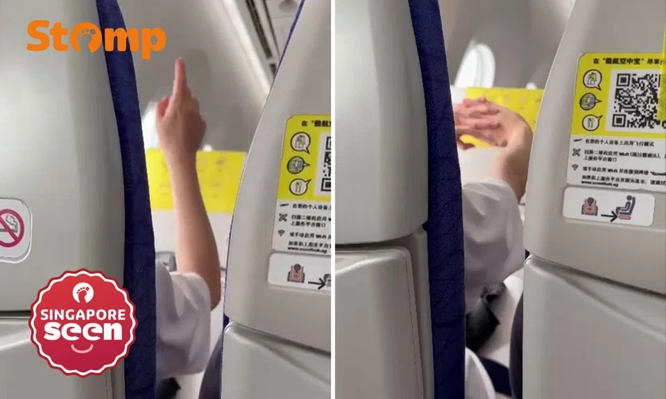woman scold man on scoot flight for non-stop videoing