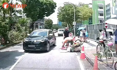 Shocking moment for cyclist, child and driver after near-accident at Seraya Road