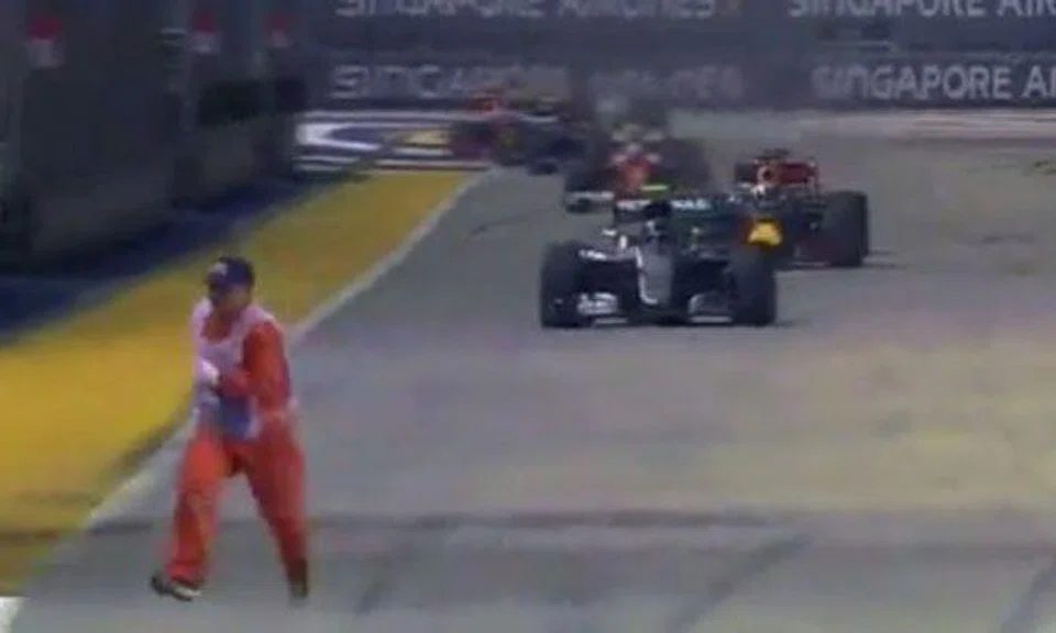 Marshal runs for his life as race restarts when he's still on track at Singapore GP