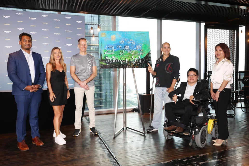 (From left) Santoz Kumar, Ironman Group's general manager for Singapore; Westin Singapore ambassador Natalie Dau; Westin Singapore general manager James Walkden; Westin Singapore ambassador Gregory Burns; Singapore Disability Sports Council committee...