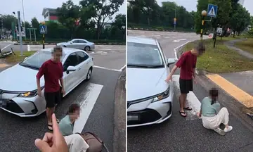 cyclist mistaken for driver after stopping to help woman