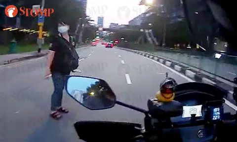 Motorcyclist has close shave with woman who 'anyhow cross road' and 'walk like pasar malan'