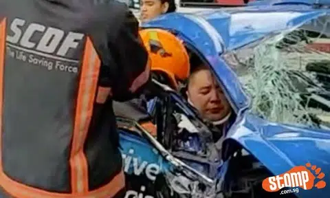 Video: Taxi driver stuck in cab after crashing into lamp post at Toh Guan Rd East