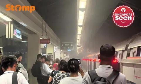 Passengers evacuate when smoke comes out of train undercarriage at Sembawang MRT station