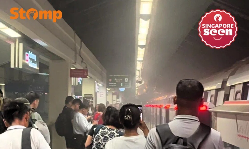 Passengers evacuate when smoke comes out of train undercarriage at Sembawang MRT station