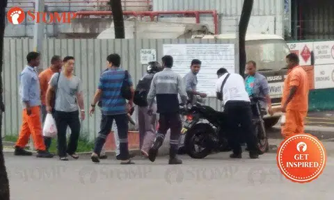 Kind souls rush to help female biker who fell after hitting car along Tanjong Kling Road