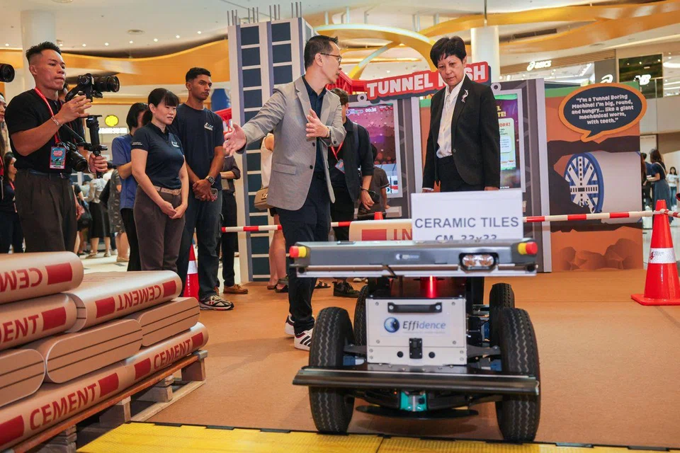 Second Minister for National Development Indranee Rajah (right) touring the Building Singapore Festival at VivoCity on Sept 5.