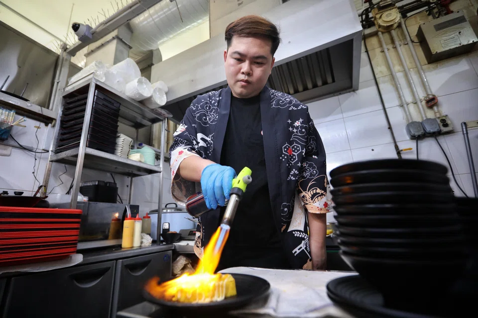 Mr Kong torches the eel for Unagi Ju Don.