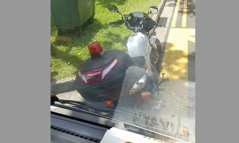 Truck driver claims enforcement officer allegedly refused to give way despite being parked illegally
