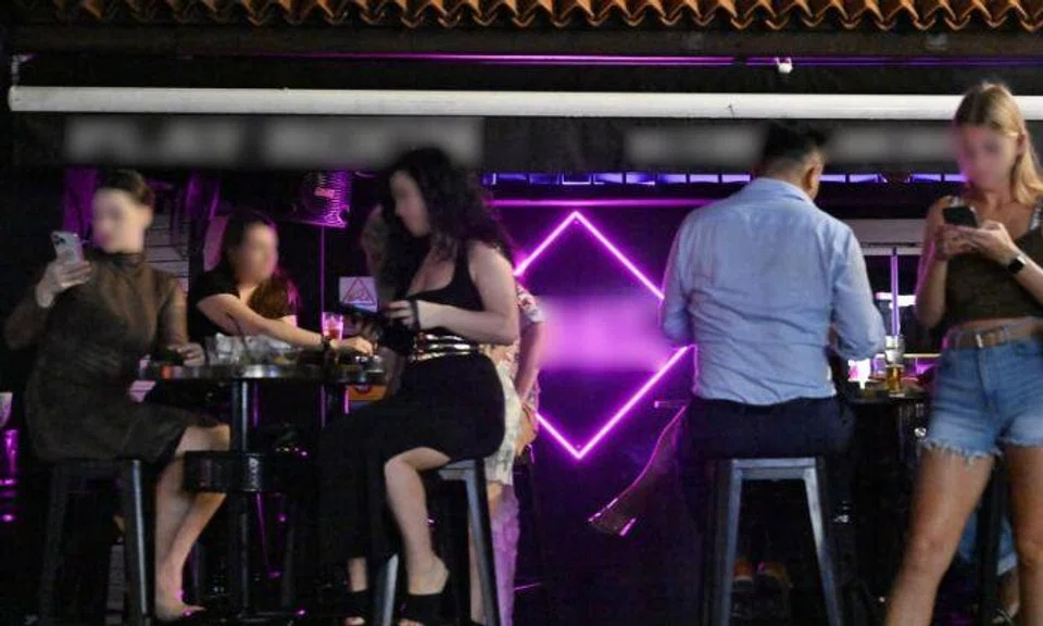 Women from Eastern European bloc countries including Russia, Ukraine, Georgia and Belarus have been operating outside a pub in Circular Road, where they get men to buy them a “special” margarita drink at $100 a glass. Photo: The Straits Times