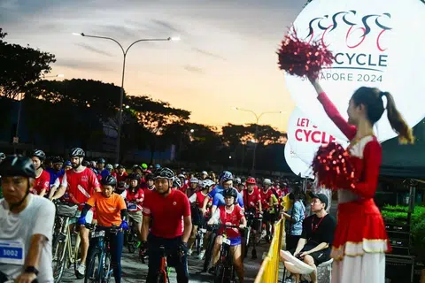 Flag off for the riders participating in The Straits Times Ride at the OCBC Cycle 2024 at the National Stadium.