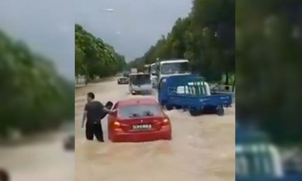 Cars along Pasir Ris Farmway nearly submerged in water after flash floods hit eastern Singapore 