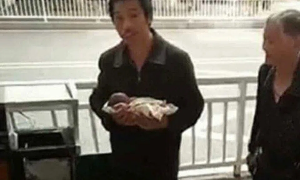 Photo:The Coverage. Rubbish collector who found the baby (left)