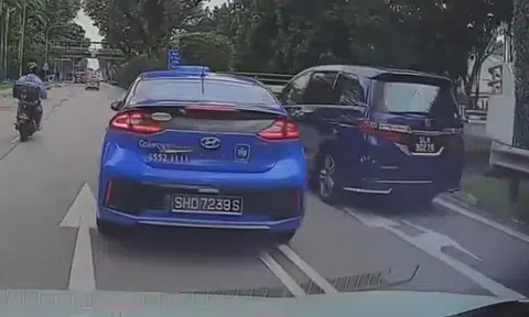 Cabby nearly causes accident after cutting across double white lines at Bukit Timah Road