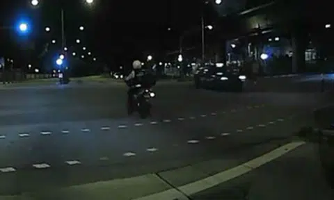 Wait, is that a traffic enforcement officer running the red light?