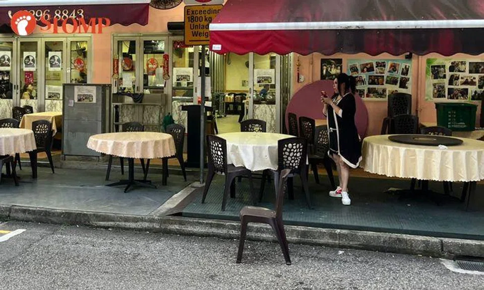 Woman uses restaurant's chair to chope parking lot for friend, refuses to budge for at least 25 min